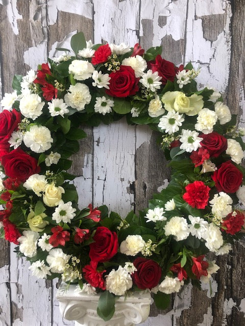 Classic red and white funeral wreath