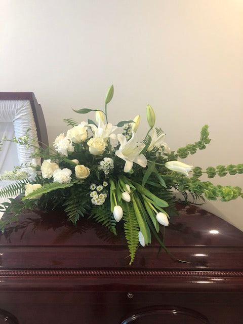 Lily and roses casket spray