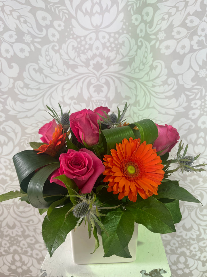 Debbie gerbera and fuchsia rose arrangement in white cube