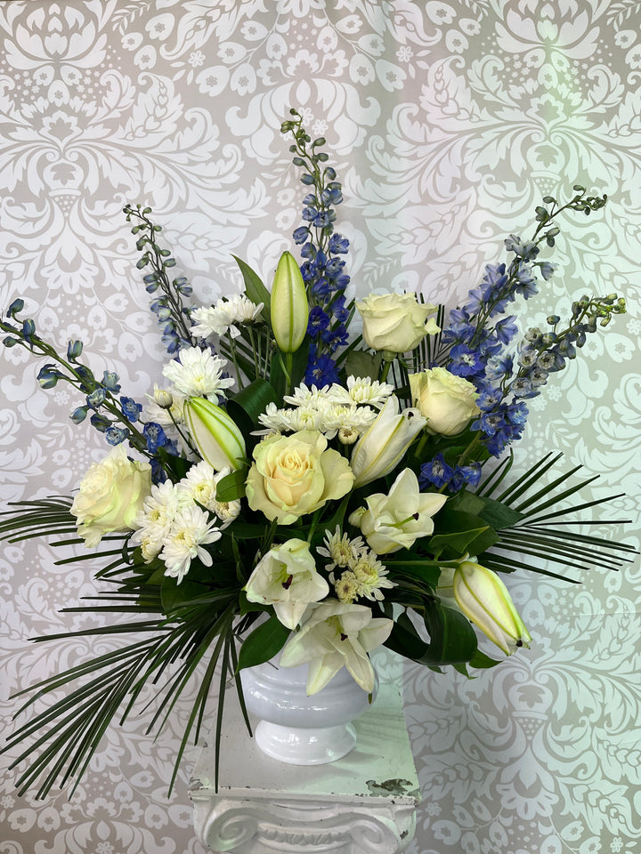 Bouquet of flowers with white and green colors on a patterned background