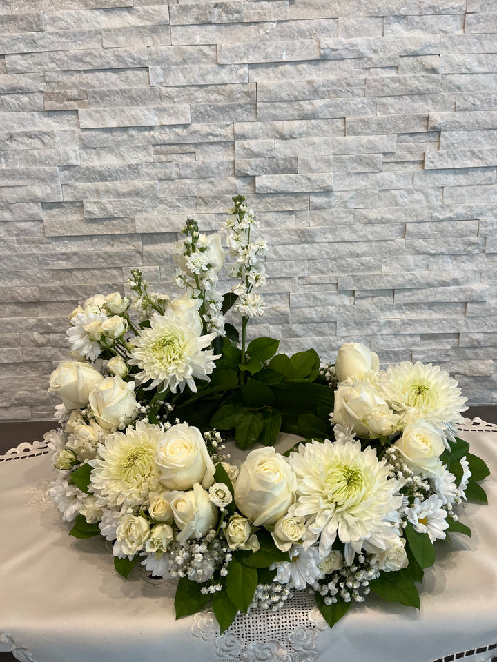 All white urn flower arrangement