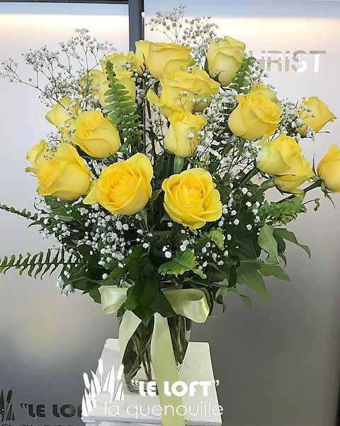 18 yellow roses in a vase arrangement